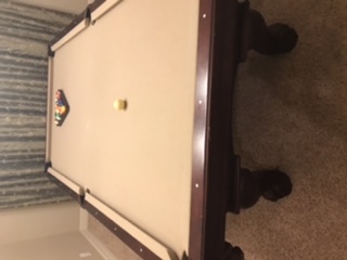 Pool table and pool stick/cue holder
